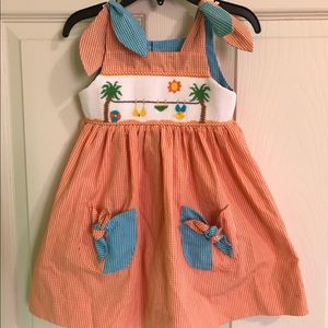 Smocked beach dress with pockets
